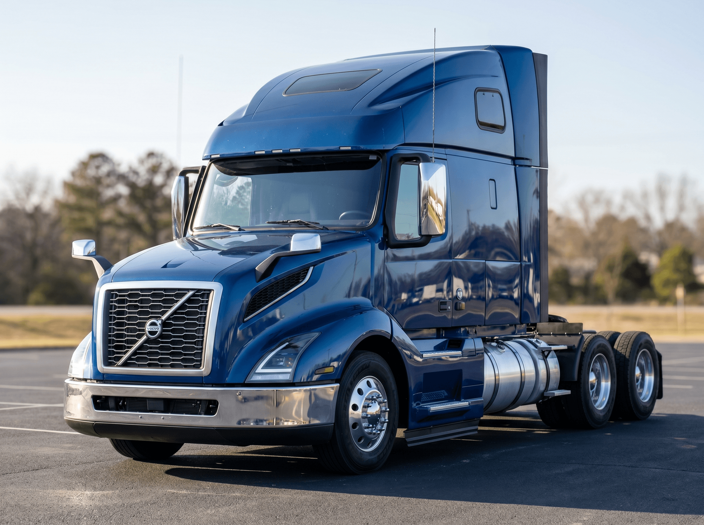 2023 Volvo VNL 760 high-roof sleeper in metallic blue on a dealership lot